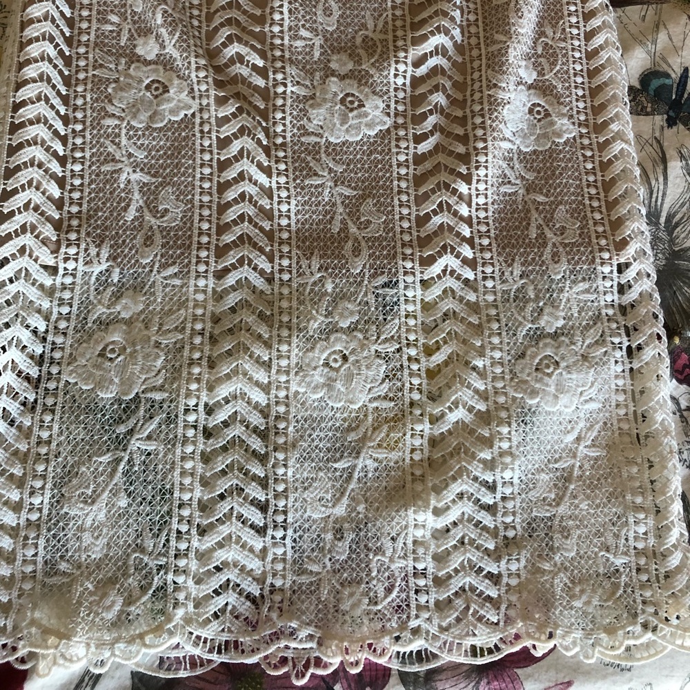 White skirt with nude lining size large.